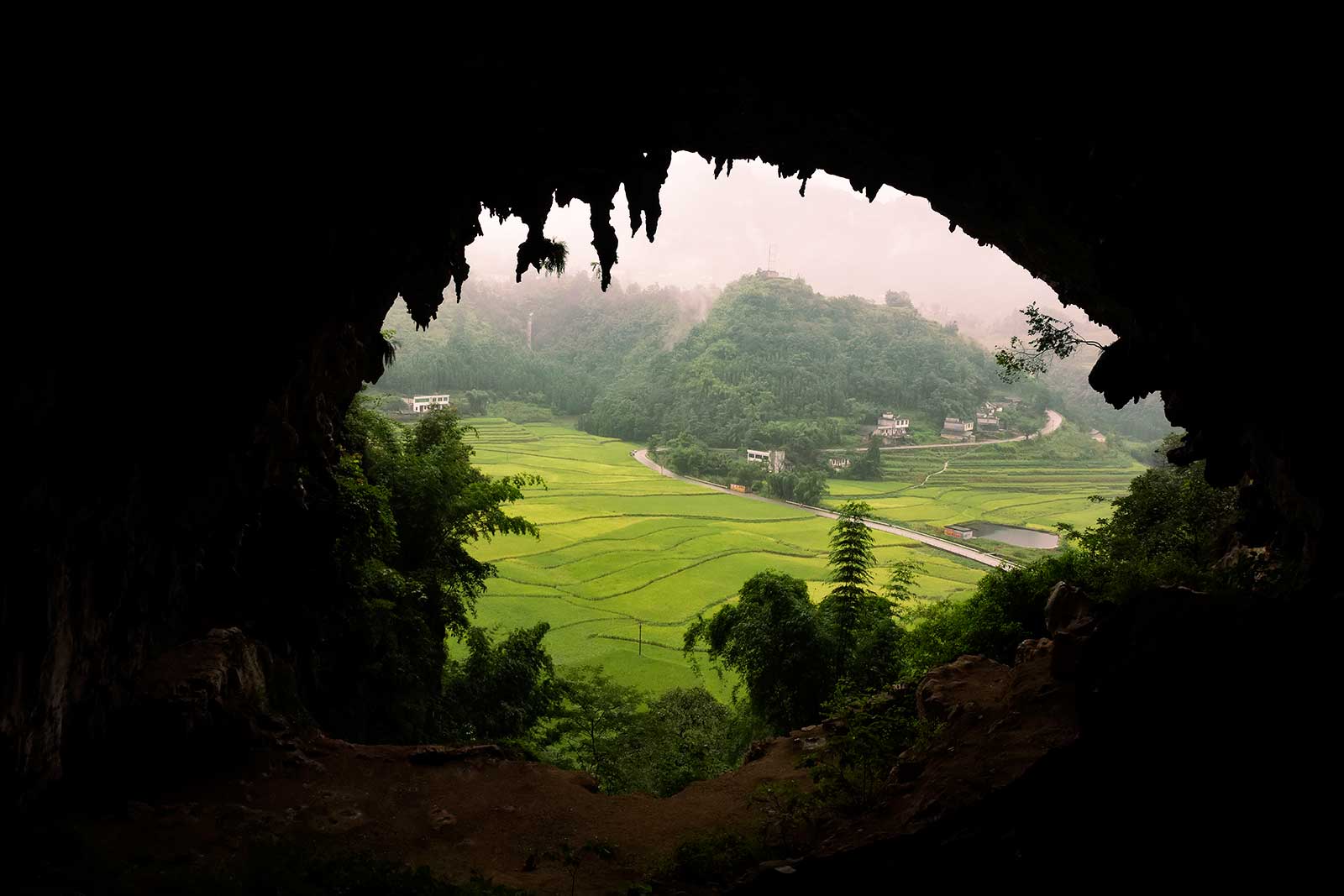 We started wandering along the path to the first set of hanging coffins and then further up into a huge cave with ruined structures inside it. The view from up here was breathtaking!