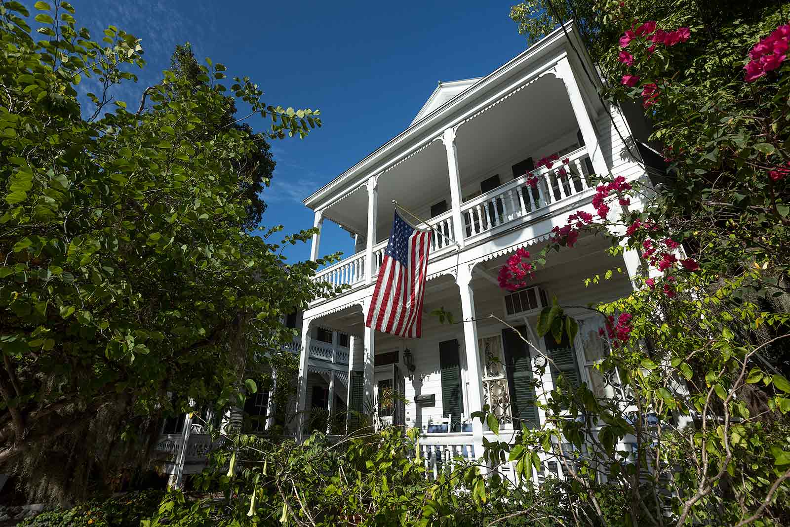 Key West houses feature fanciful elements like slim columns topped with decorative wooden details.