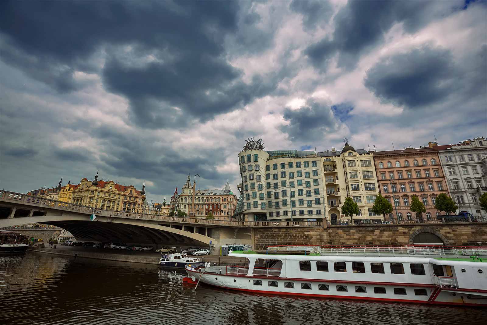 The Dancing House (designed by architects Vlado Milunic and Frank Gehry) in Prague is set by the Vltava River. Its design is unique, and especially striking in the city centre because it is a modern building surrounded by historic architecture.