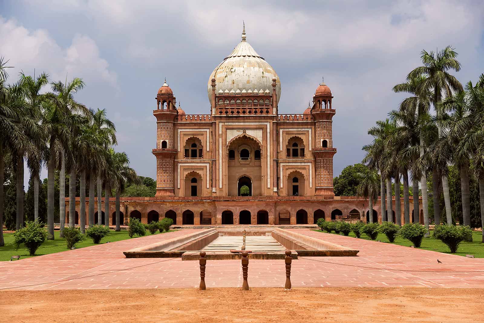 Safdarjung's Tomb is a double storey mausoleum built with red and buff sandstone. The garden is divided into four squares by side pathways and tanks which are again divided into smaller squares and pathways.