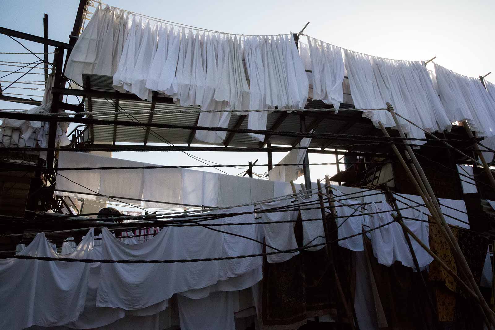 The area of Mahalakshmi extends across several city blocks and has many winding alleys, workrooms and semi-covered subsections of aluminum siding.