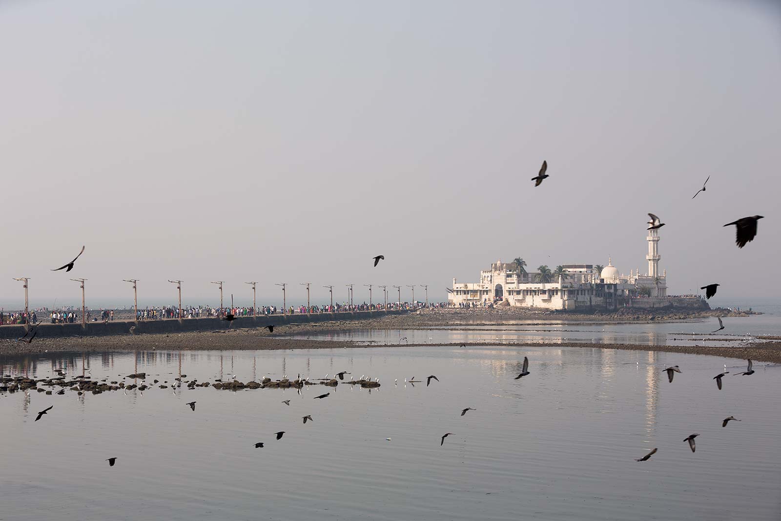 Built in 1431, this Mughal-style architectural marvel serves as a reminder of the city’s rich and multicultural history. The six-hundred-year-old dargah is dedicated to the memory of Sayyed Pir Haji Ali Shah Bukhari. Sitting atop a set of large rocks in the sea, the Haji Ali Dargah features stunning white-marble pillars, domes and minarets, which showcase Indo-Islamic architecture at its finest.