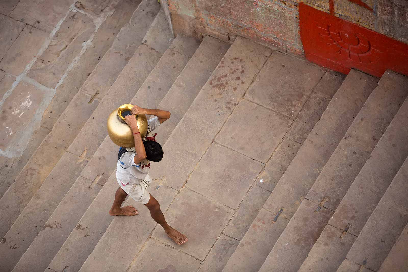 The water of the Ganges river is holy and many visitors bring is back home in carafes.