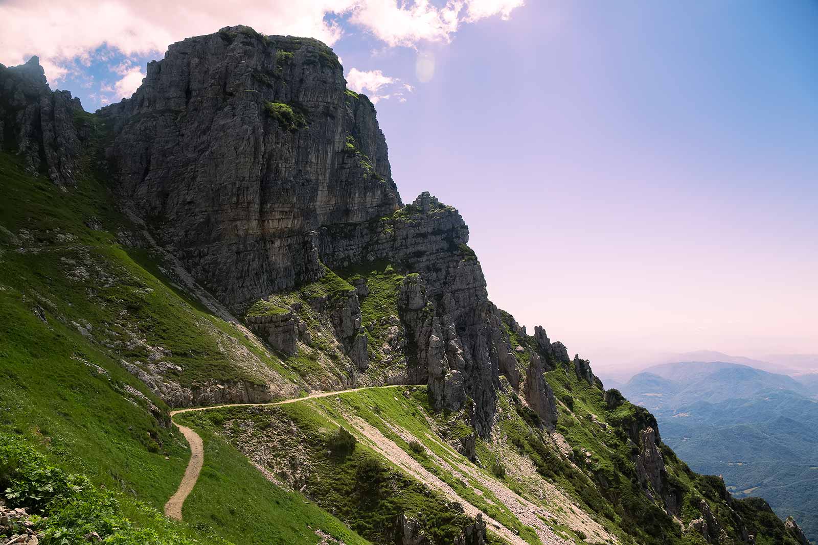 The Strada delle 52 Gallerie trail alternates between a dirt track and tunnels dug out of the mountain.