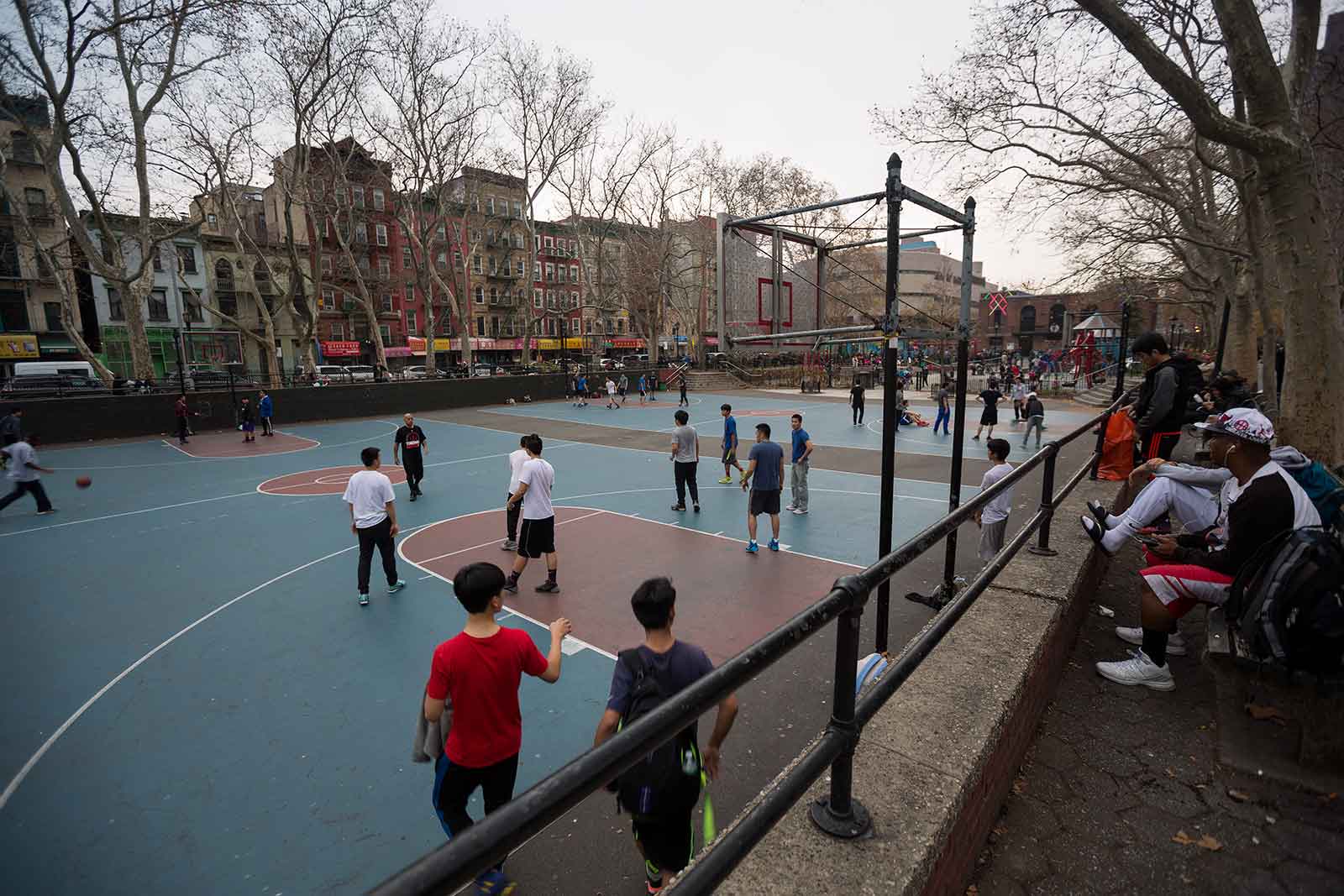 The basketball courts just off of Grand Street in Chinatown are the perfect spots for people-viewing.