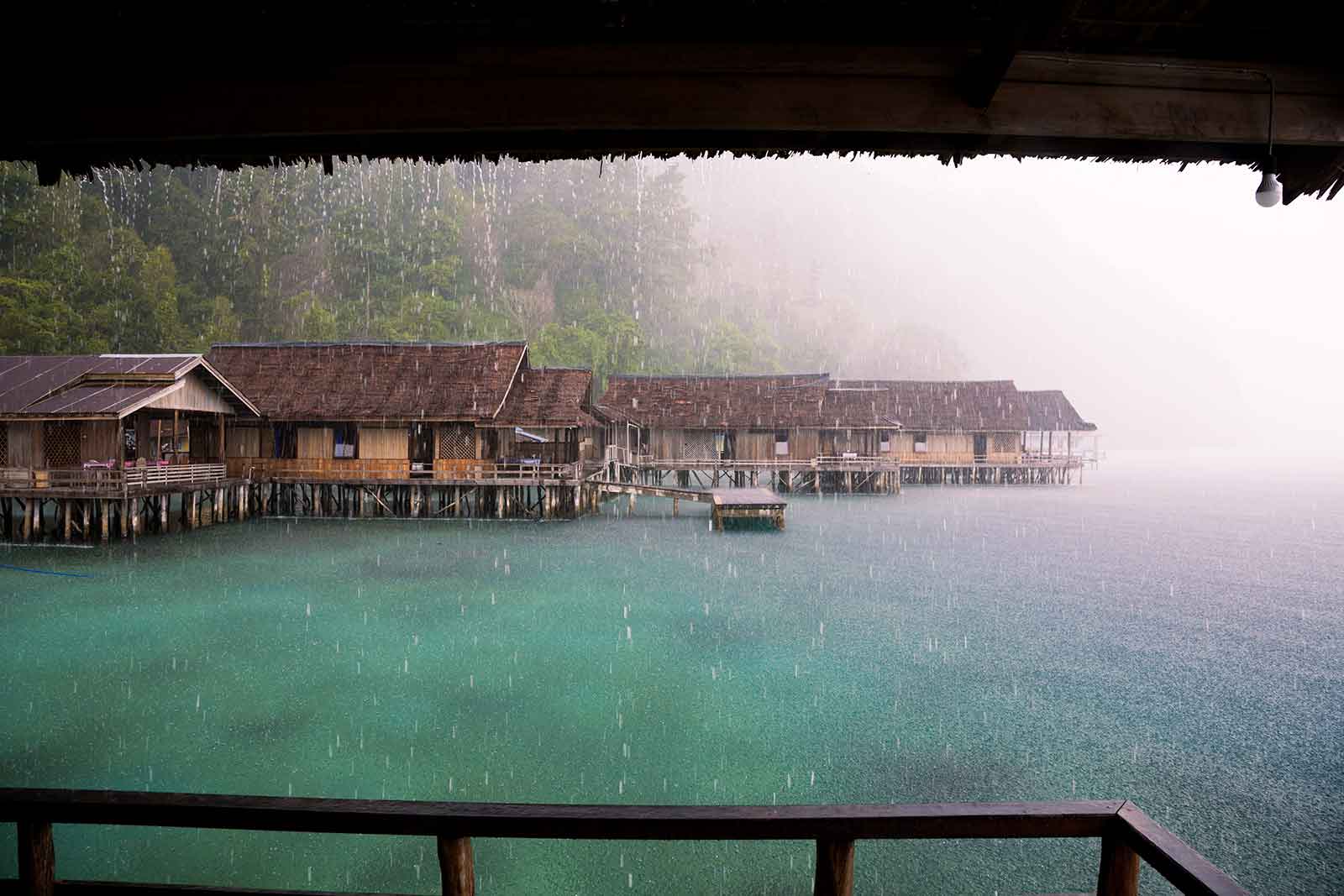 Maluku Islands: If you're visiting Indonesia during the rainy season, you'll have to face downpours like this quite often. Sometimes it rains for days, sometimes the rain stops just as fast as it came. Here we were at Lisar Bahari Resort in Sawai on Seram island and it was actually a mystical atmosphere being above the water with this heavy storm hitting us.